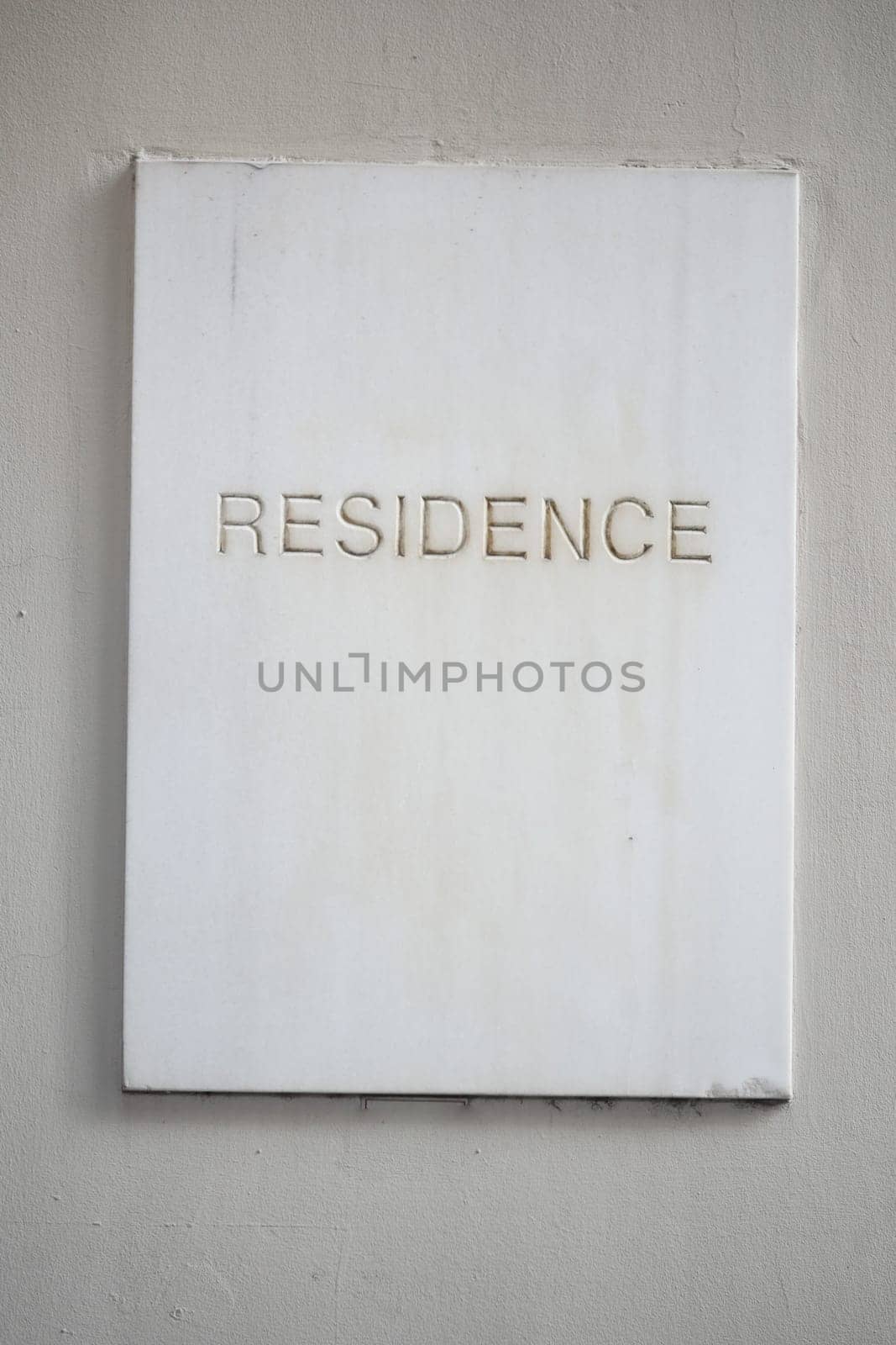 Simple white plaque with the word residence displayed prominently.