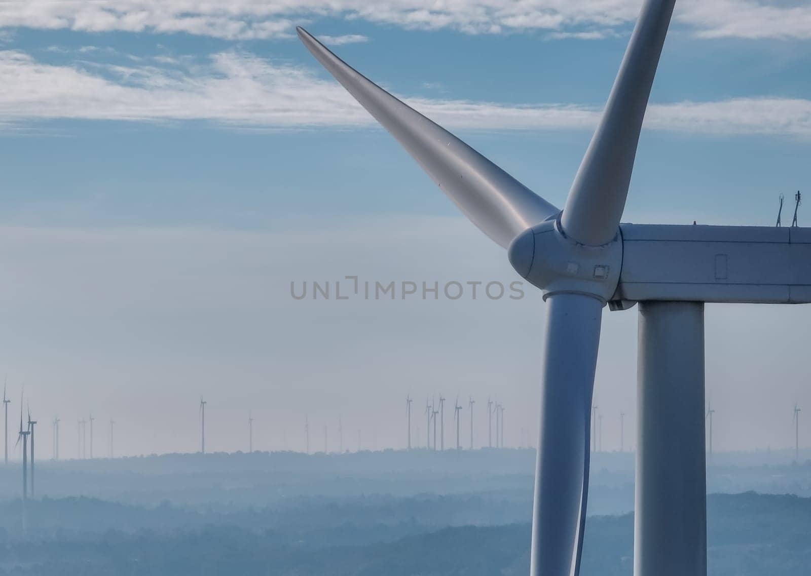 Wind energy. Wind power. Sustainable, renewable energy. Wind turbines generate electricity. Wind farm. Sustainable resources. Sustainable development. Green technology for energy sustainability.