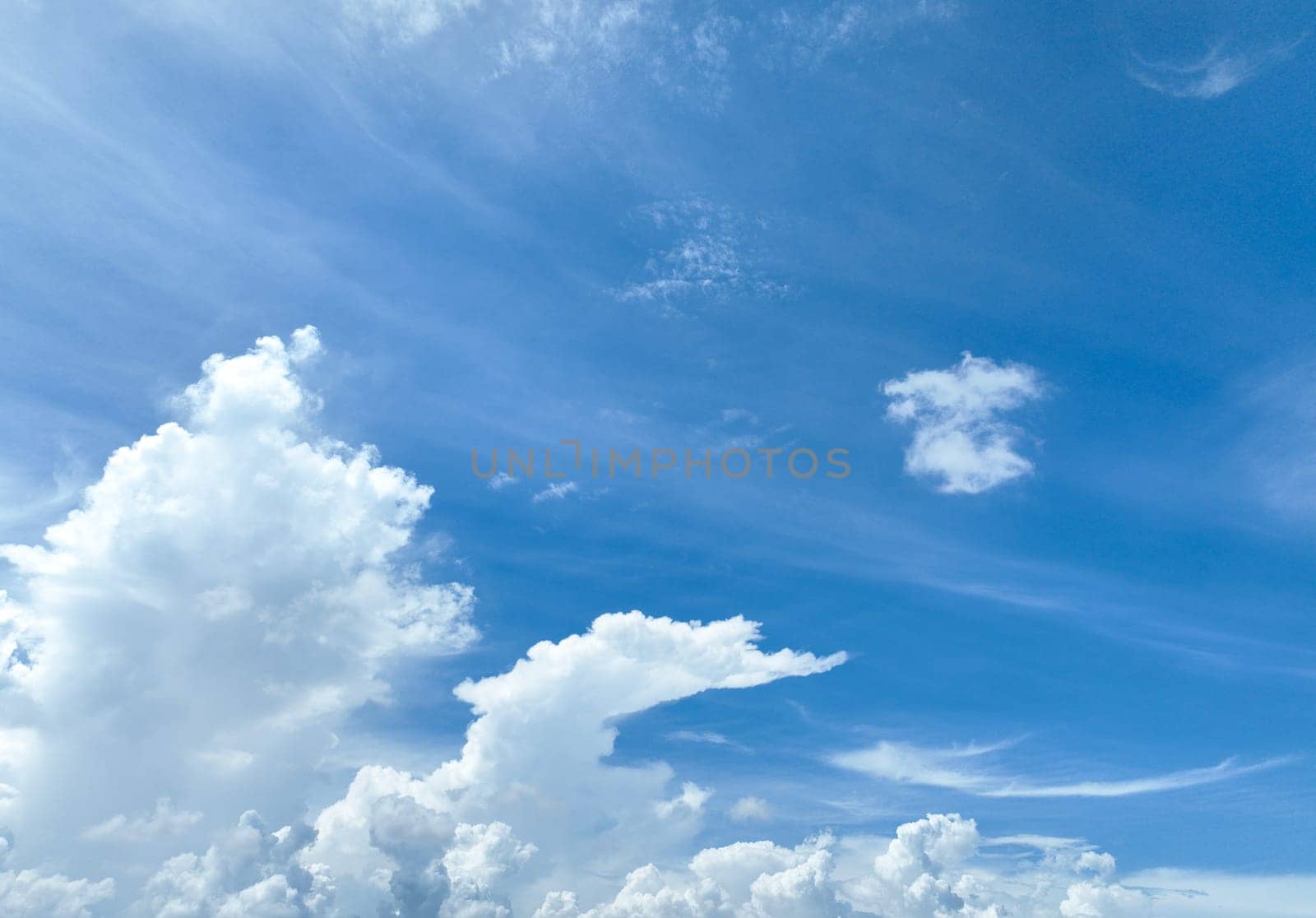 Beautiful blue sky and white cumulus clouds abstract background. Cloudscape background. Blue sky and fluffy white clouds on sunny day. Blue sky and daylight. World Ozone Day. Ozone layer. Summer sky.
