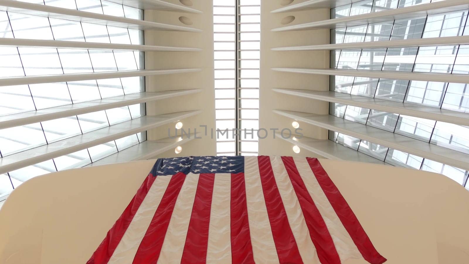 New York City, United States - 10 Sept 2023: World Trade Center Oculus architecture. Manhattan Downtown Financial District, USA. September 11 remembrance, large memorial american flag. 911 Patriot day