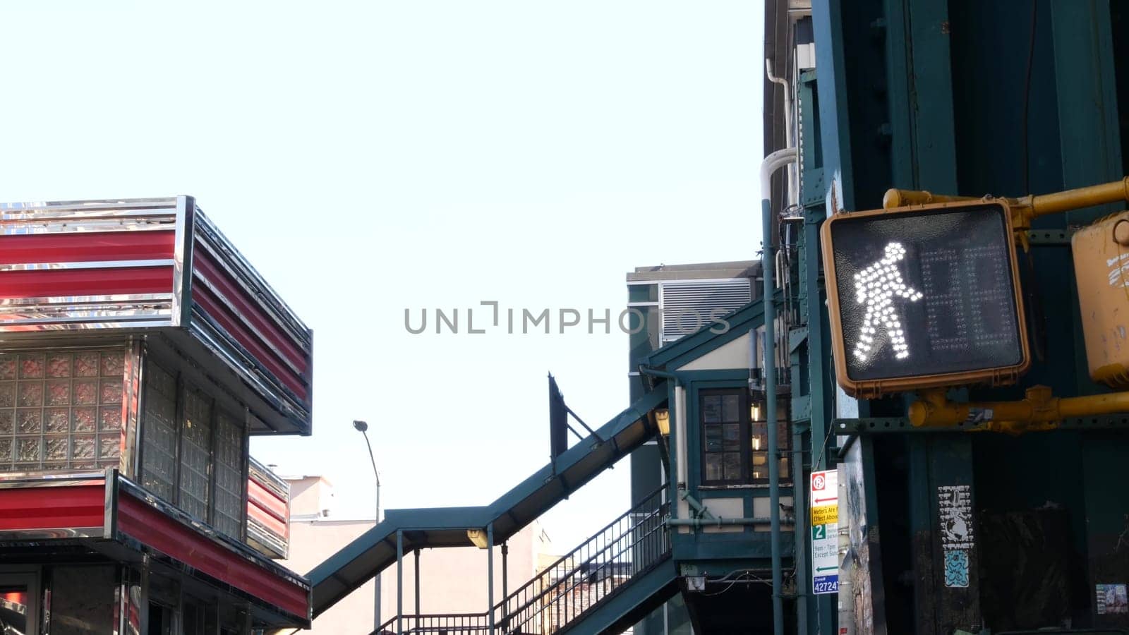 New York City, United States, 1 Sept 2023: Elevated subway, metropolitan bridge, metro track over street. Railway transport over road. Diner restaurant. Queens railroad line, Court Square, Long Island
