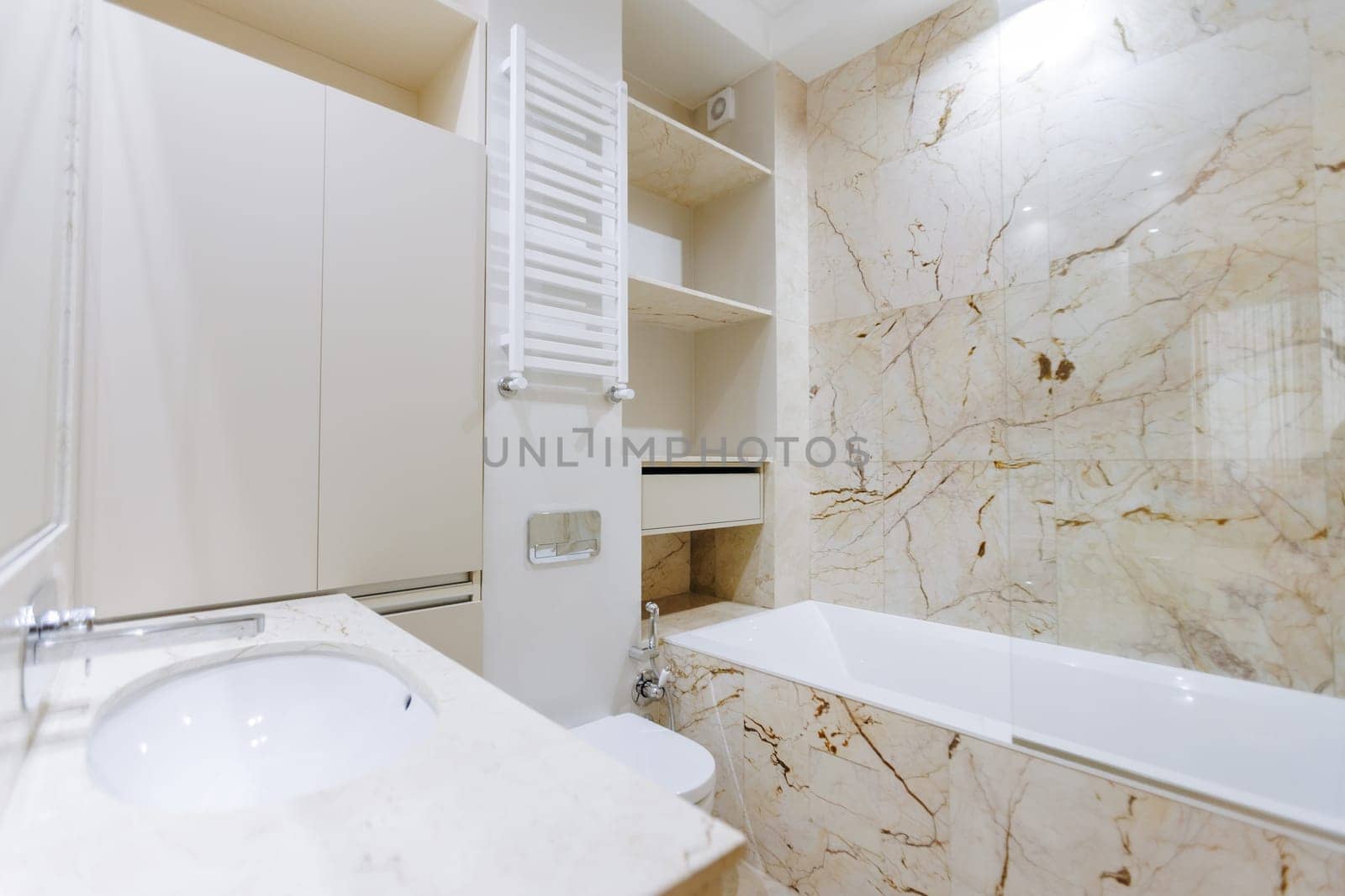 A bathroom that features essential fixtures such as a sink, a toilet, and a bathtub, providing both functionality and comfort