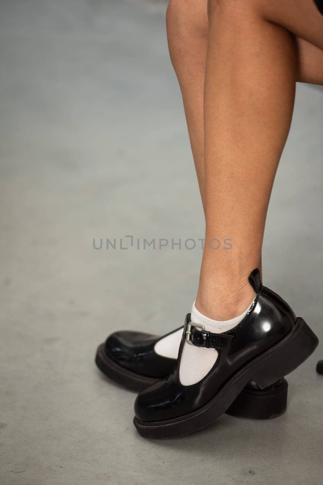 Shiny Black Patent Leather Loafers Side View Classic and Elegant Footwear for Women.