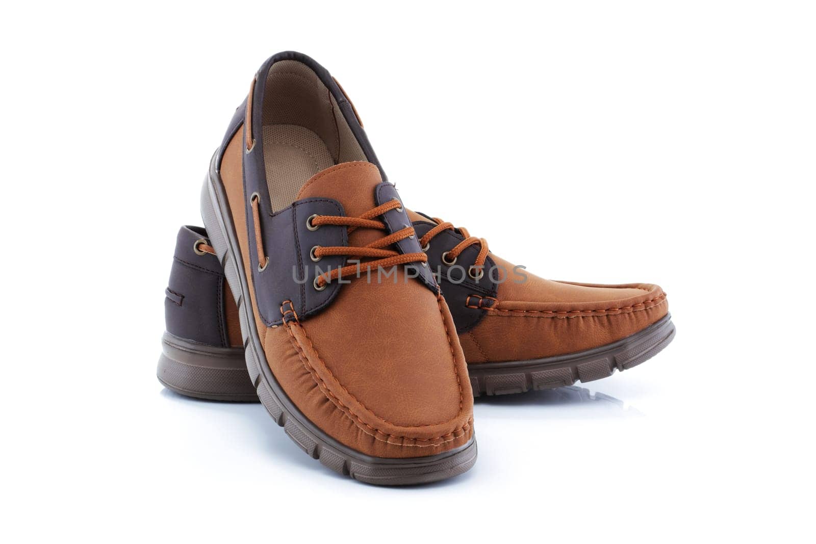 A pair of mens brown shoes loafers
