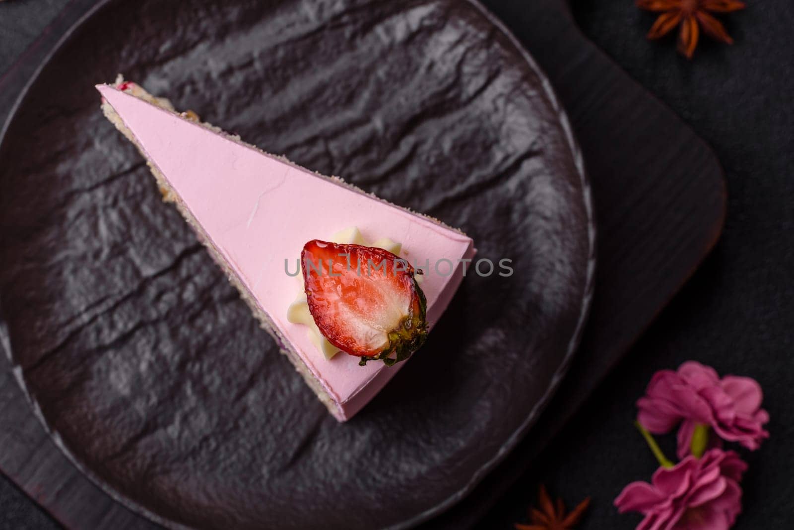 A slice of pink colored puff cake for a birthday celebration. Sweets to celebrate a wedding or valentine's day