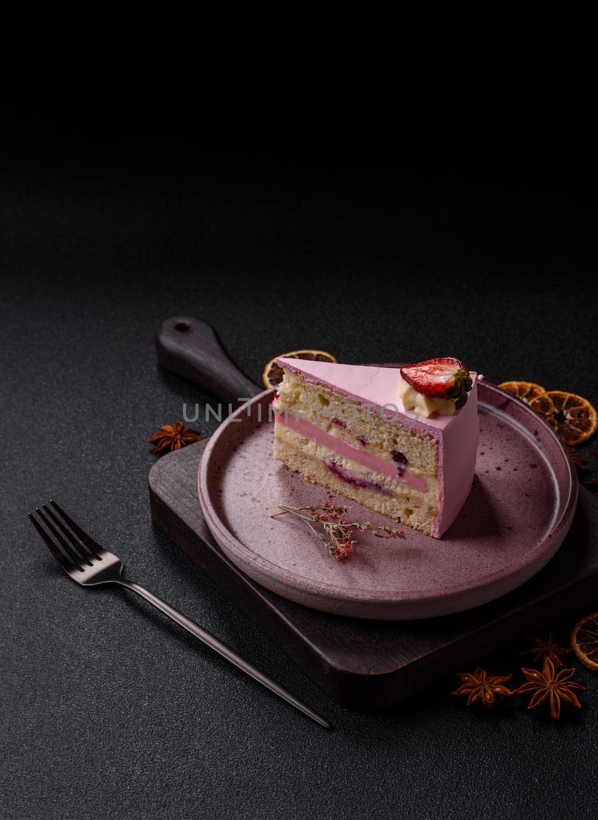 A slice of pink colored puff cake for a birthday celebration. Sweets to celebrate a wedding or valentine's day
