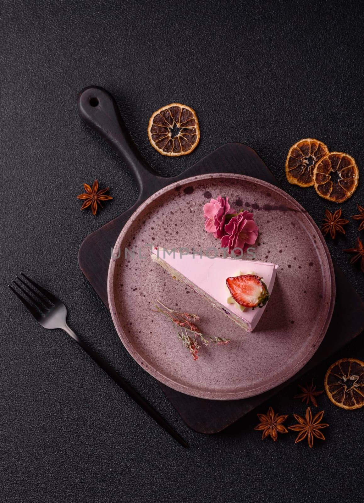 A slice of pink colored puff cake for a birthday celebration. Sweets to celebrate a wedding or valentine's day