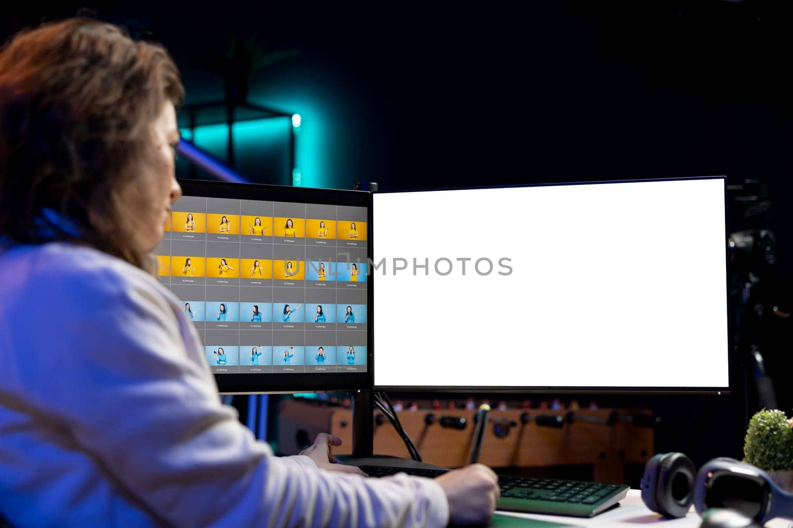 Photo editor using isolated screen monitor to color correct photographs in creative studio. Photographer selecting best pictures for editorial content with mockup desktop computer