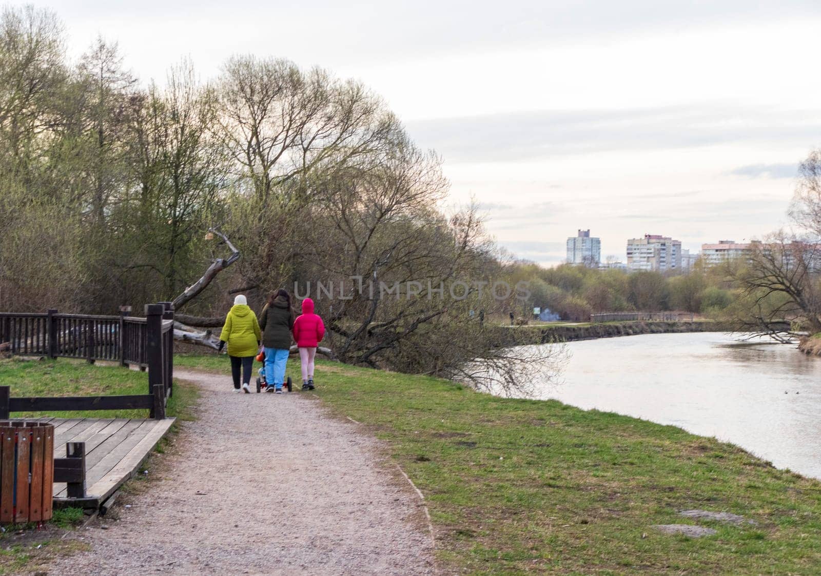 Family walks outdoor by the pond