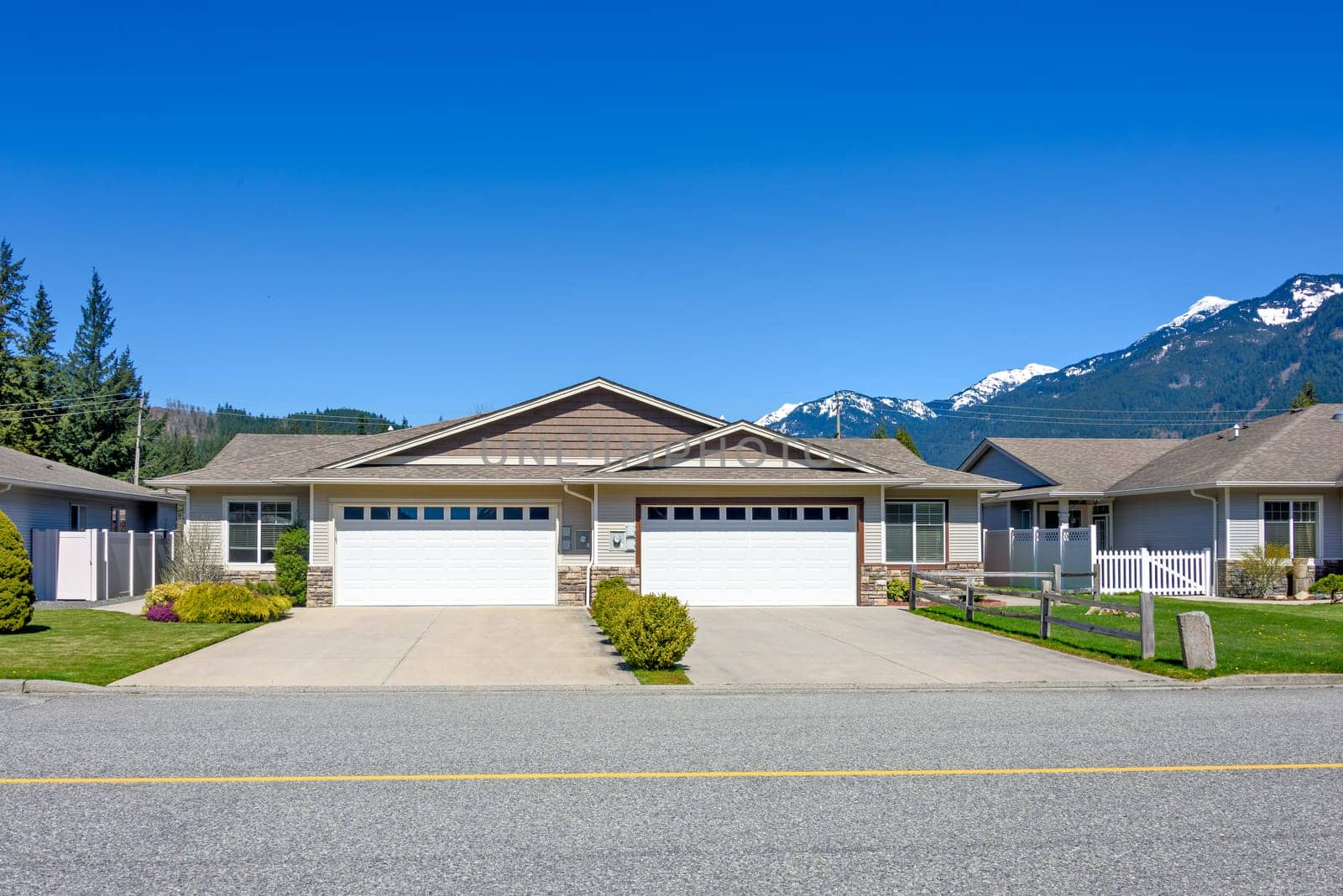 New residential duplex house on beautiful nature background in British Columbia.