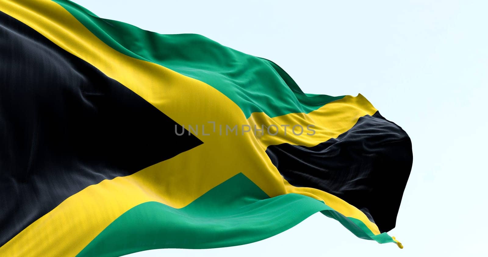 High-resolution 3D render of the Jamaican flag fluttering in the wind. Iconic yellow saltire represents national pride, freedom, and Caribbean identity. Perfect for editorial and tourism use