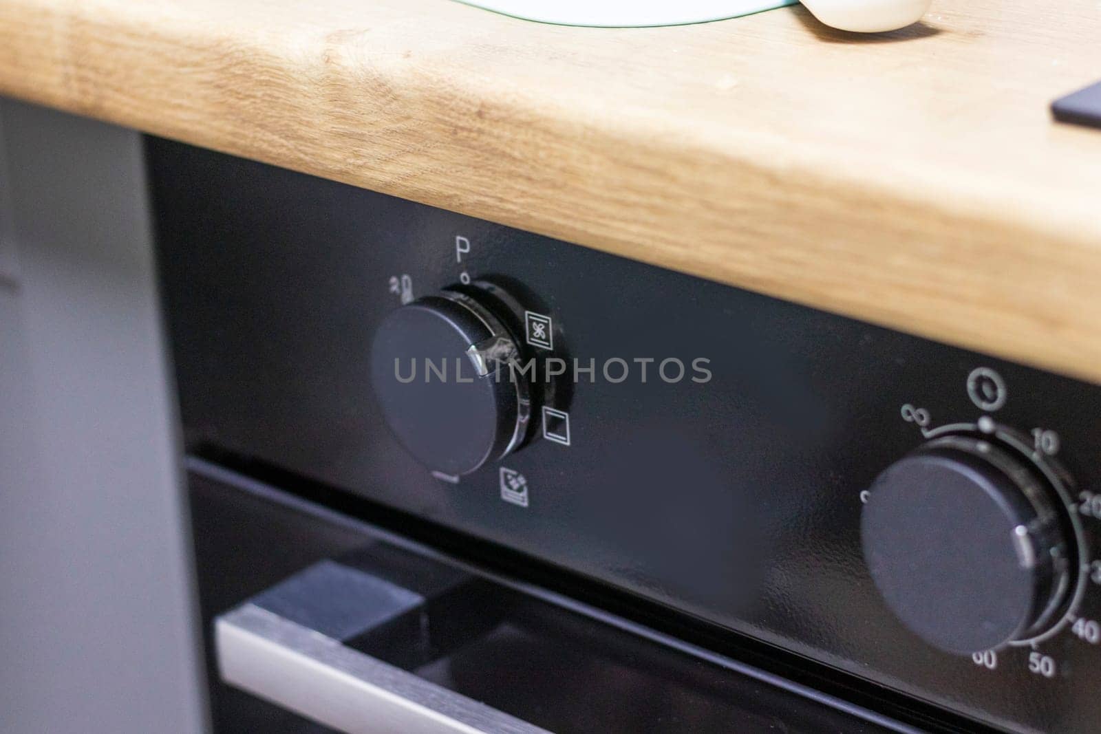 Close up of the timer and mode relays of the oven