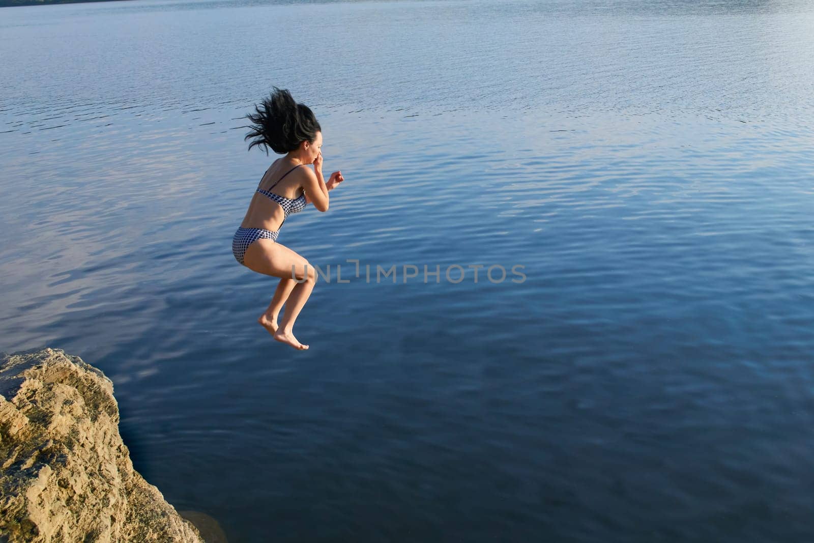 the sport or activity of propelling oneself through water using the limbs