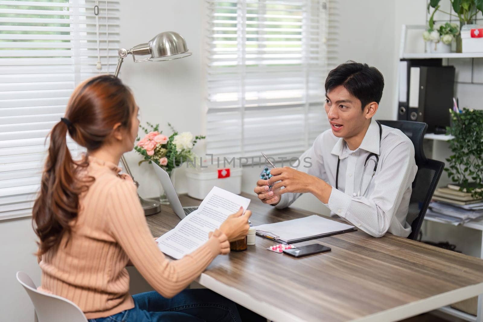 The healthcare expert converses with a patient about her medication regimen, ensuring she comprehends treatment instructions in a supportive atmosphere.
