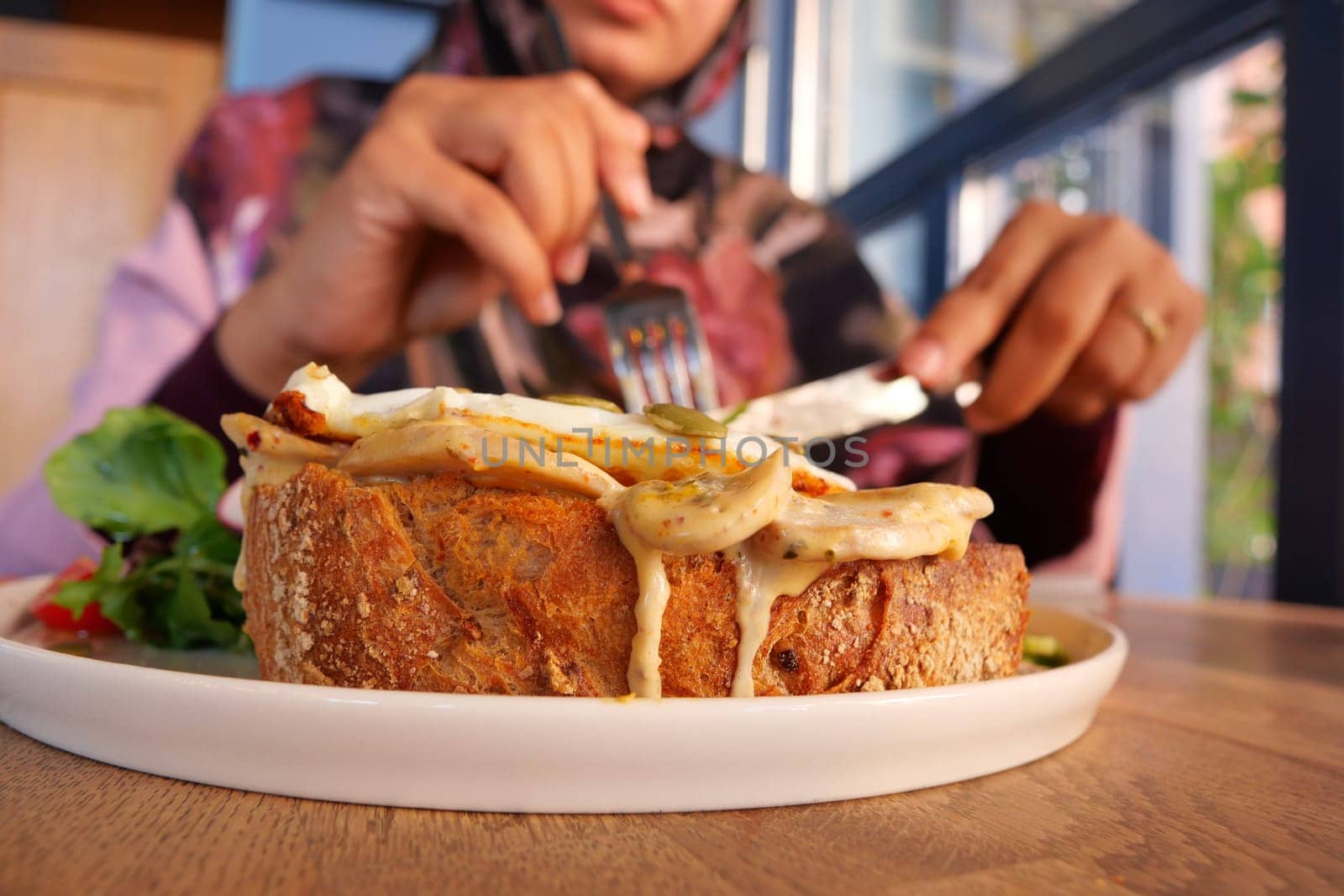 Enjoying a hearty meal at a cozy cafe during brunch hours.