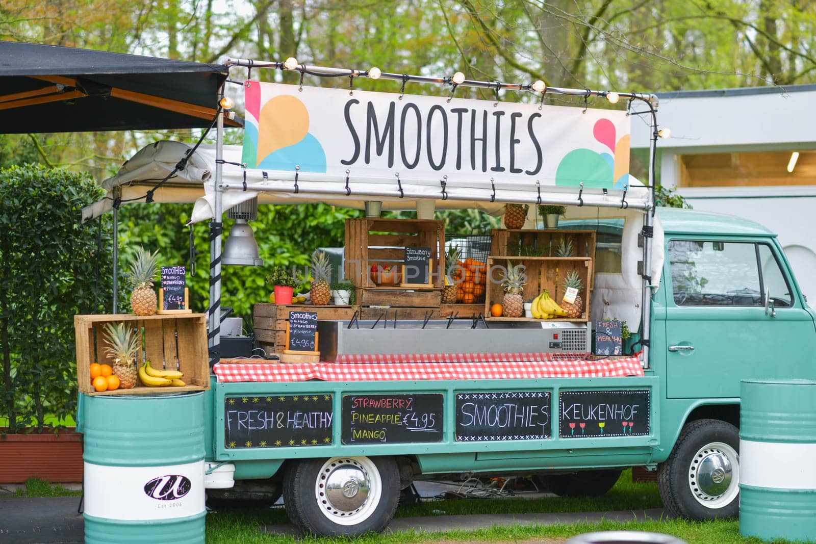 Lisse, Netherlands - April 17, 2019: Mobile bar minivan on wheels for selling snacks and smoothies in a Keukenhof park Decoration