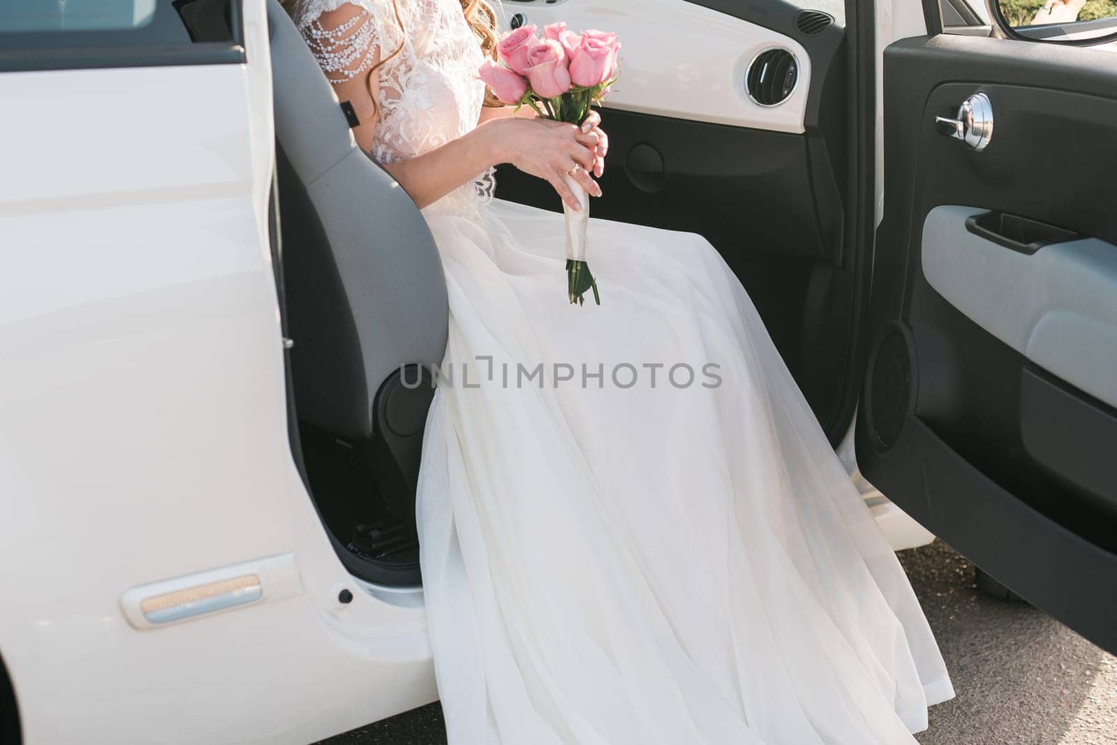 Bride holds a wedding bouquet, wedding dress, wedding details