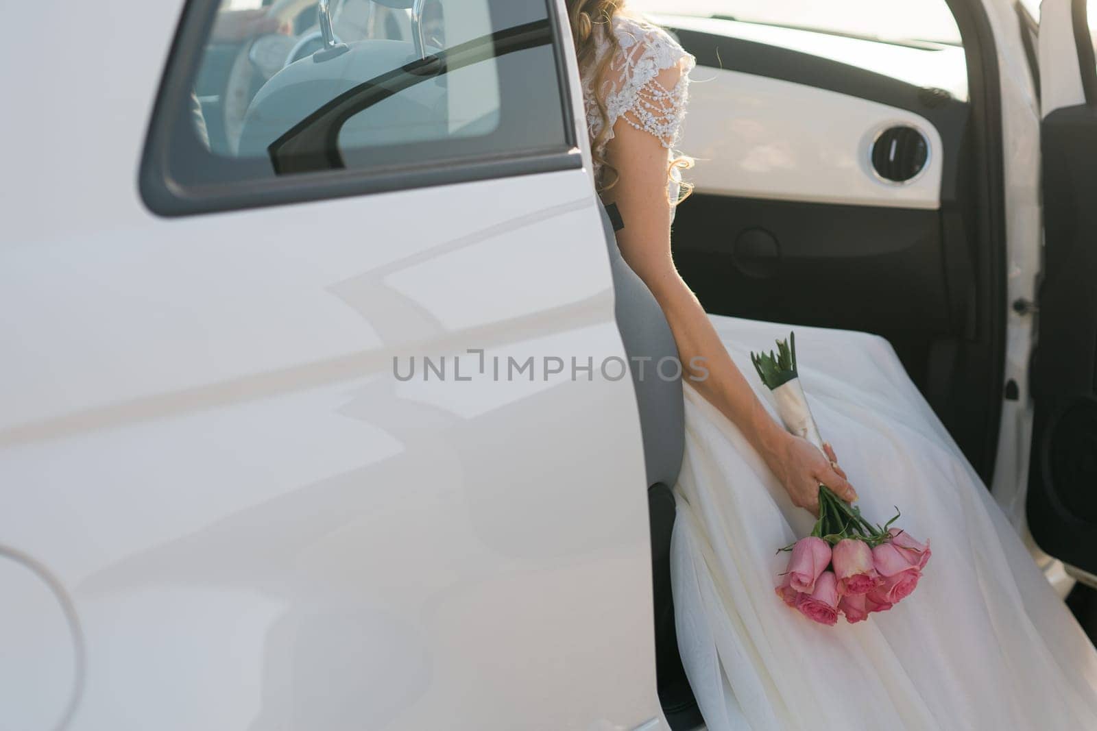 Bride holds a wedding bouquet, wedding dress, wedding details