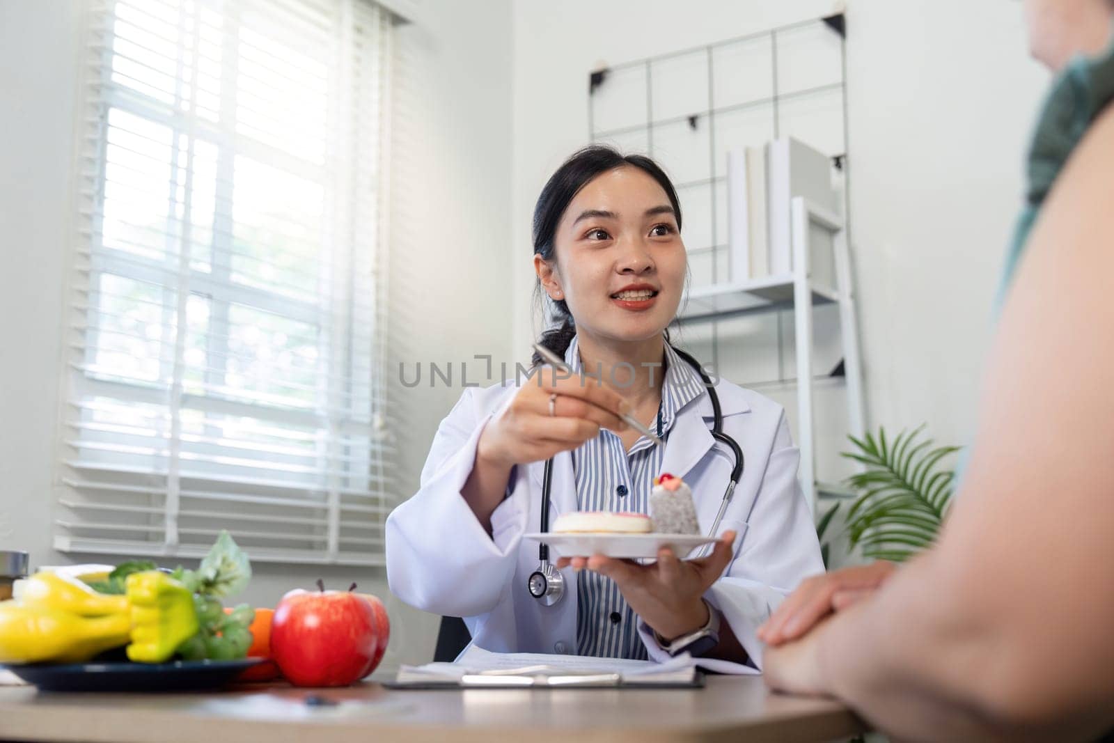 The healthcare provider engages the patient in meaningful dialogue about dessert and fruit choices, advocating for nutritional awareness.