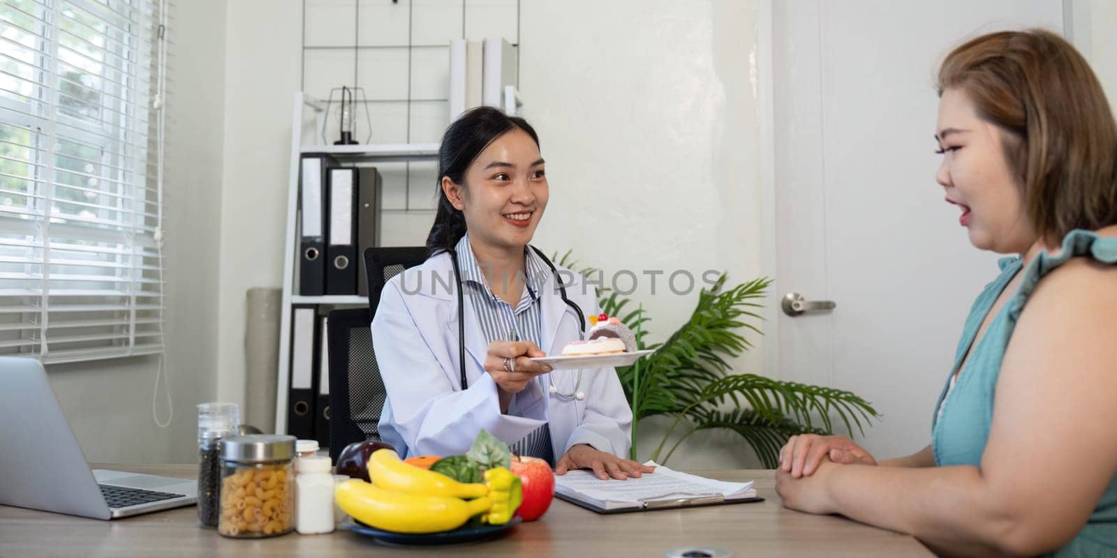 A doctor discusses nutrition with a patient, offering a dessert choice alongside healthy food options, promoting wellness through informed eating.