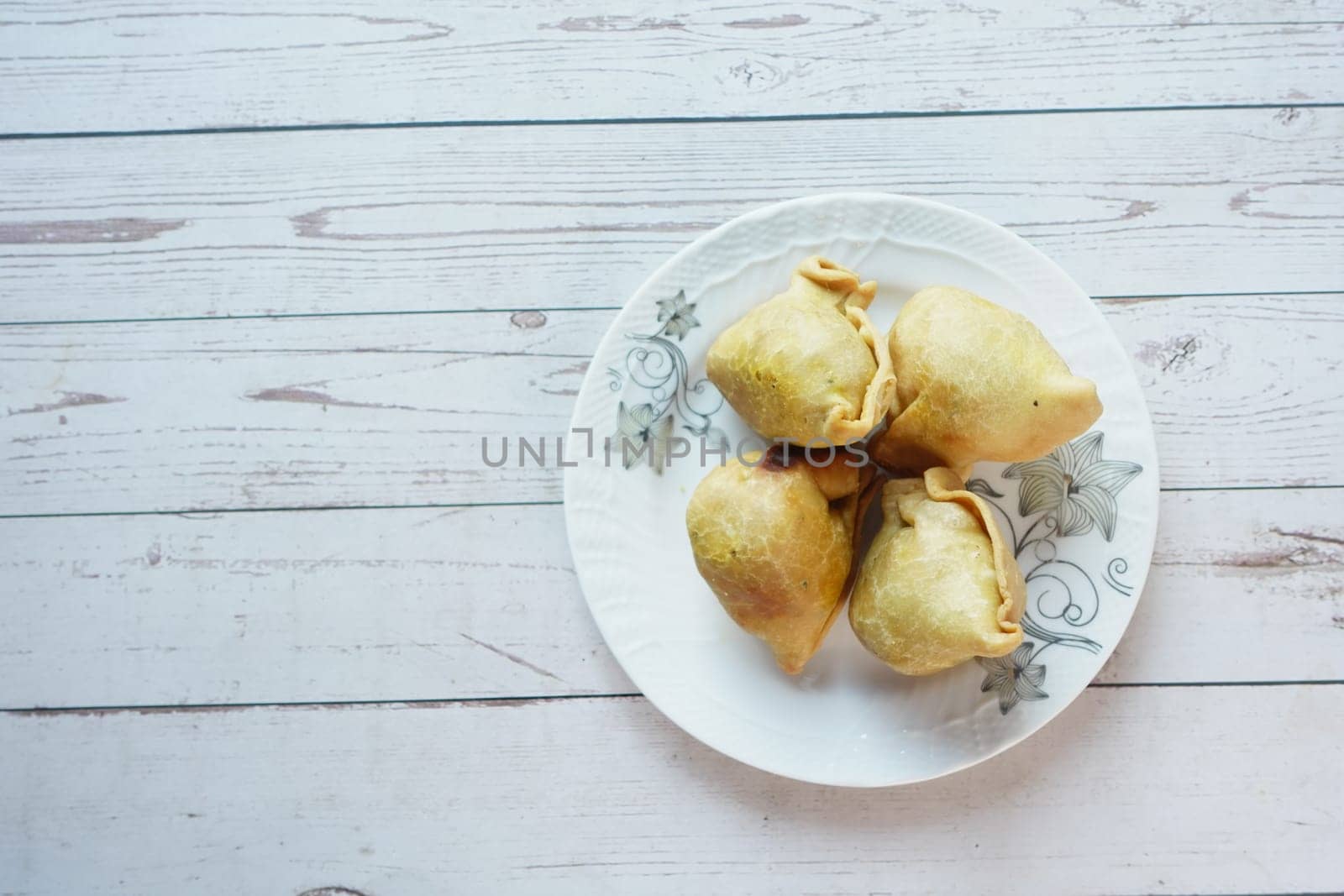 top view of indian street for singara on a plate .