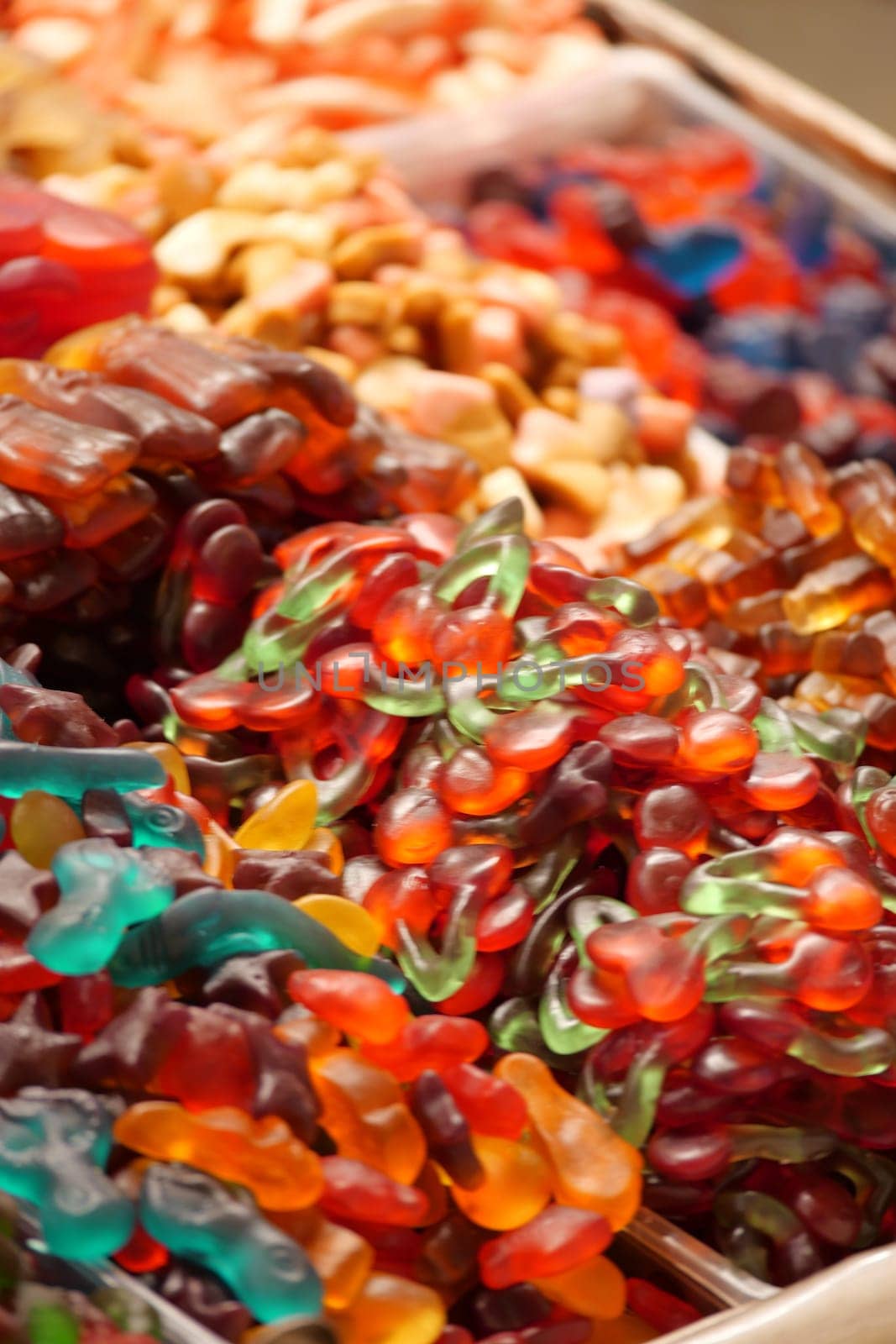 Vibrant assortment of gummy bears and candy shapes attracting visitors.