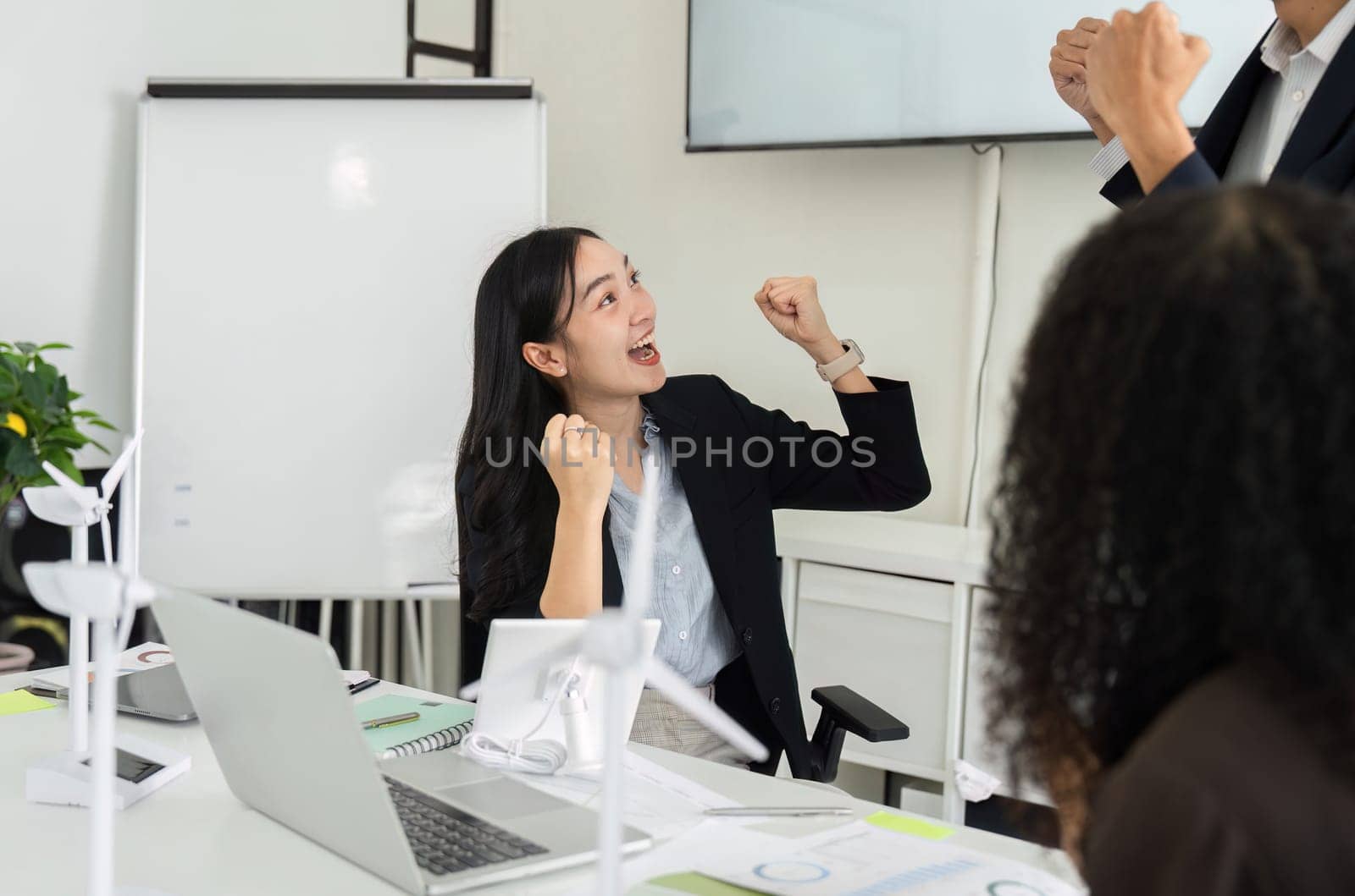 A team member at the meeting expresses excitement about their recent achievements related to ESG strategies, showcasing a culture of collaboration and positivity in sustainability efforts.