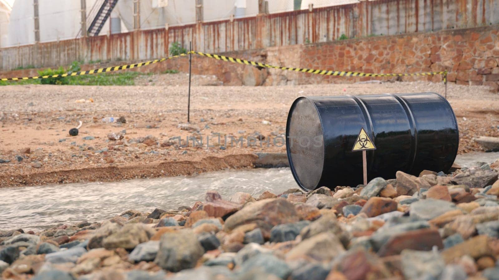 Close up of industry oil fuel tank spilling water pollution, Conserve water and Environment Issue, biohazard caution of collects sample of waste from industrial