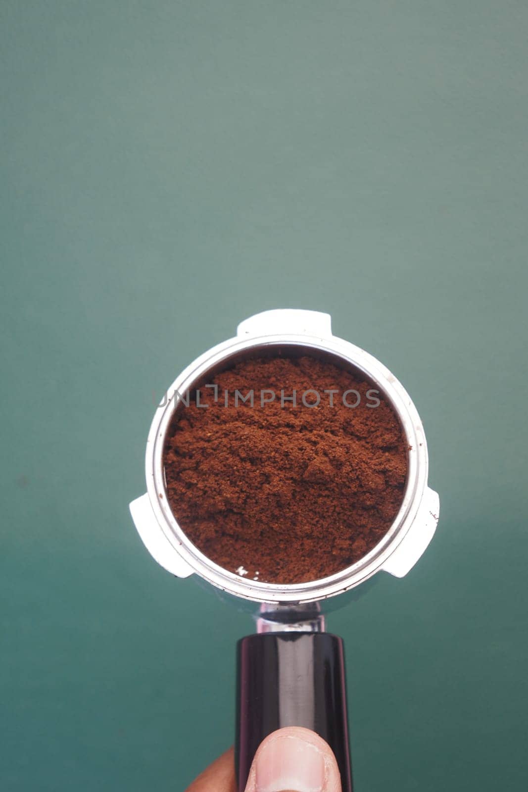 Freshly ground coffee nestled in a portafilter, ready for brewing.