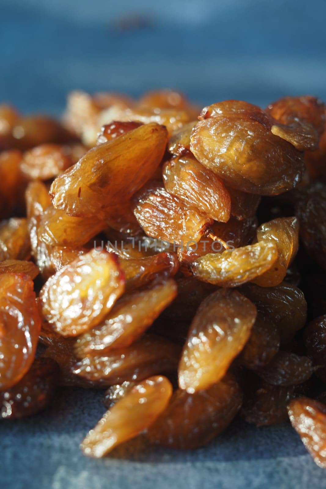 Golden raisins are arranged neatly, showcasing their natural shine and texture.