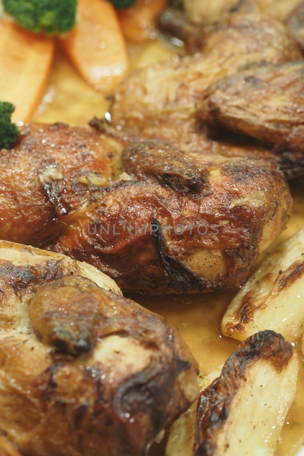 Succulent roasted chicken pieces served with tender vegetables and rich sauce.