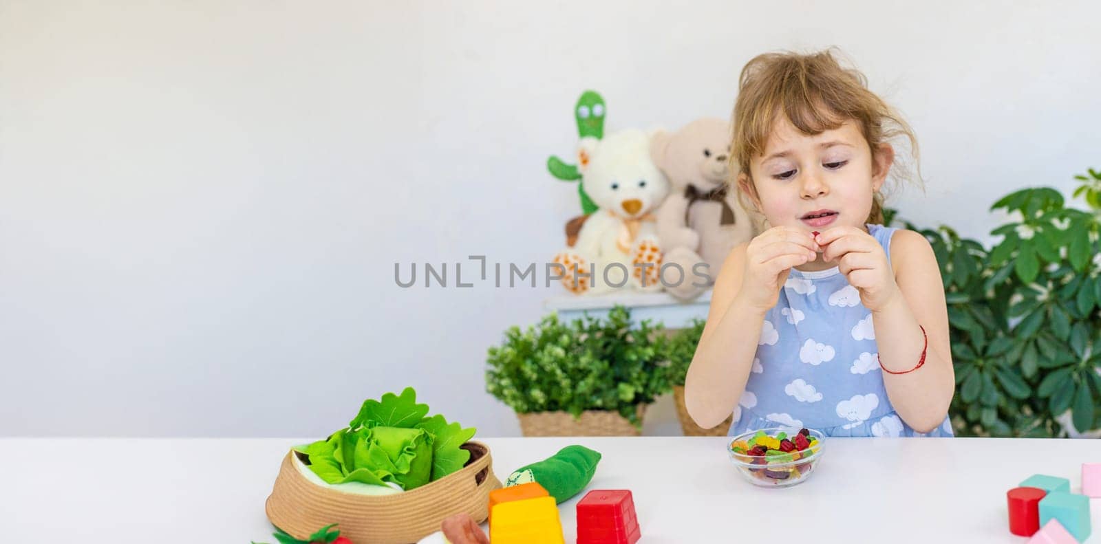 Child with jelly candies. Selective focus. kid.