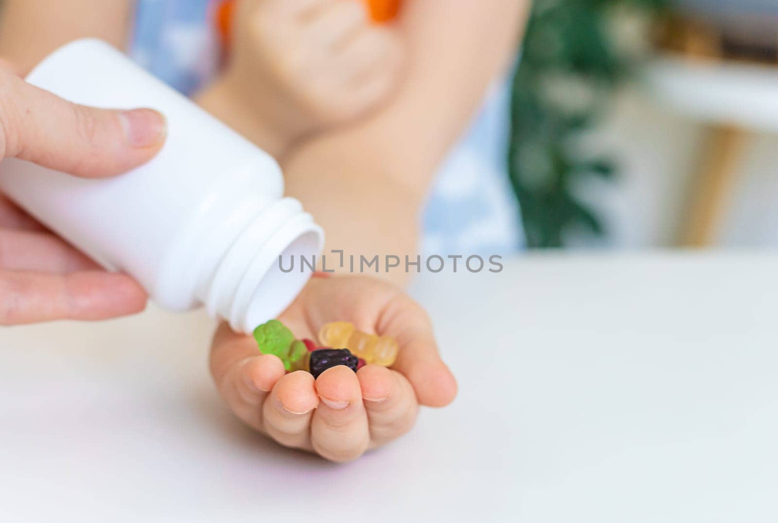 Child with jelly candies. Selective focus. kid.