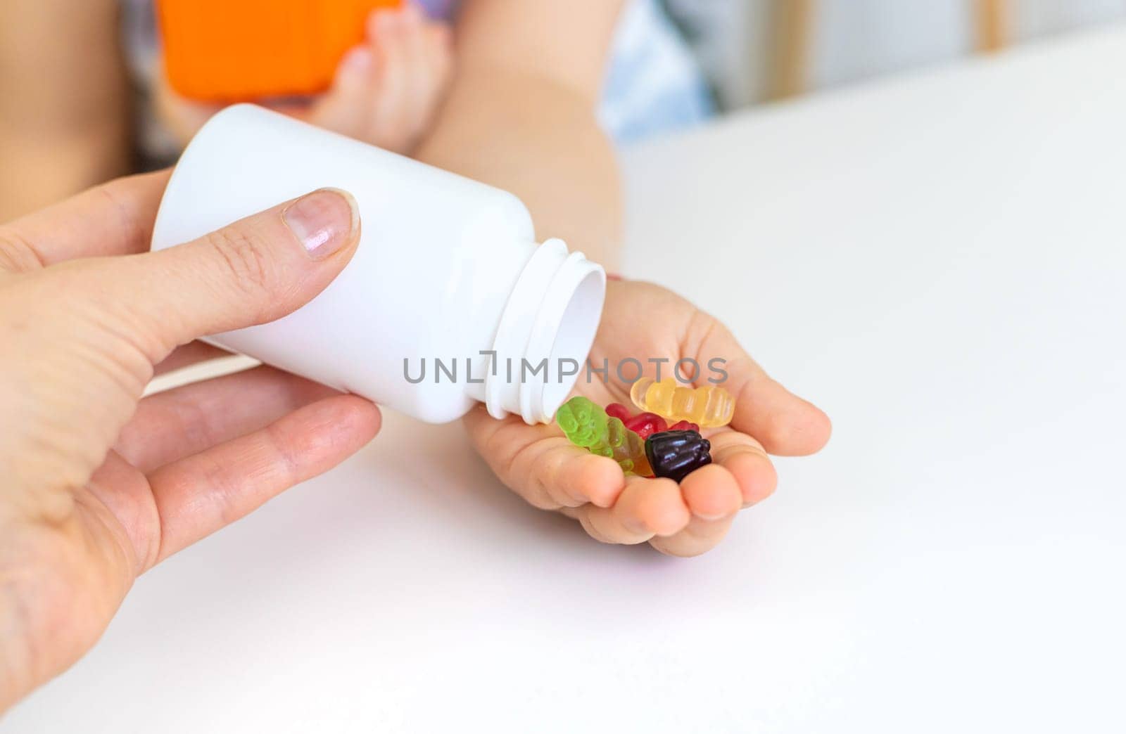 Child with jelly candies. Selective focus. kid.