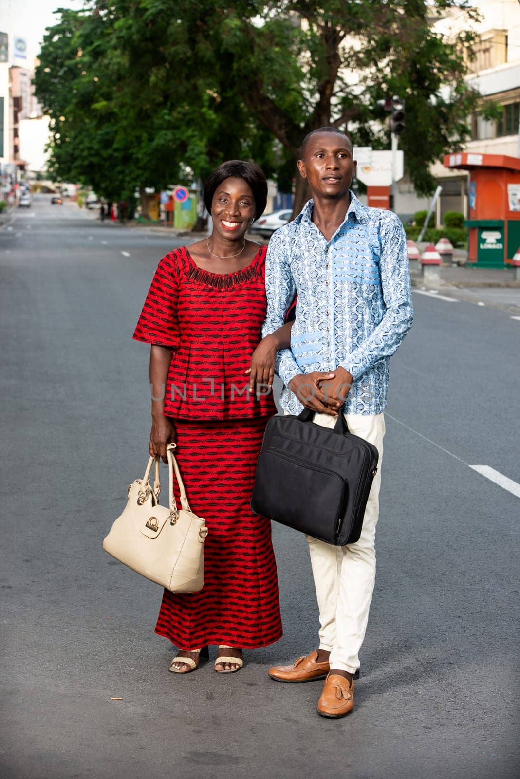 middle aged man and woman talking business portrait and standing outside with trees in the background
