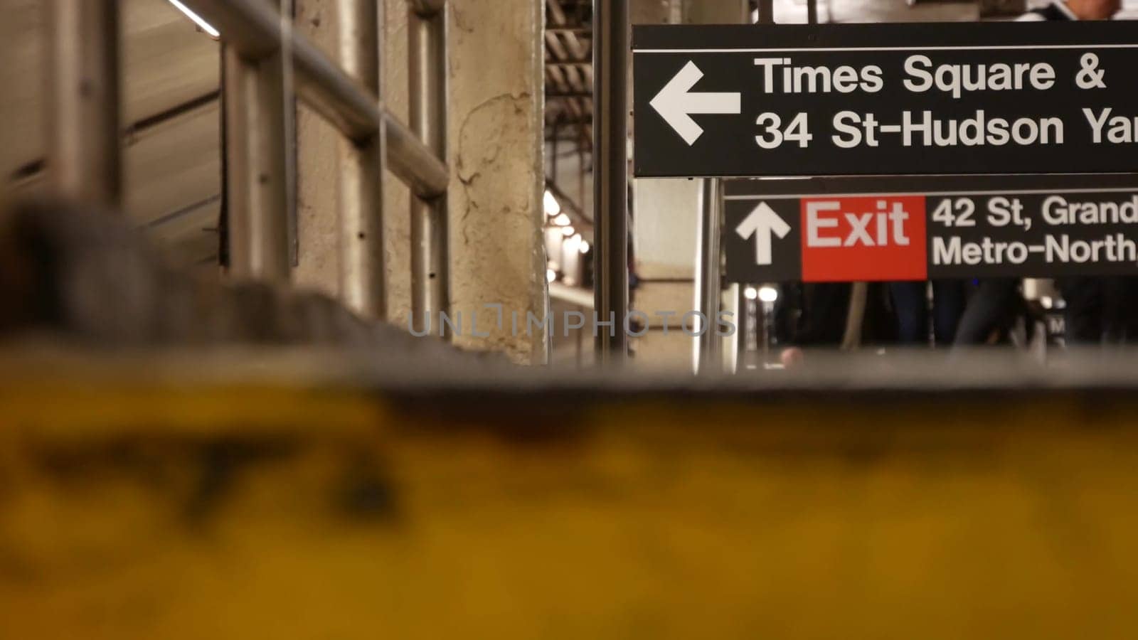 New York City, United States - 31 Aug 2023 Subway station interior, underground metropolitan platform. Public metro transportation. Railway passenger traffic. Text sign Times Square, Grand Central, 42