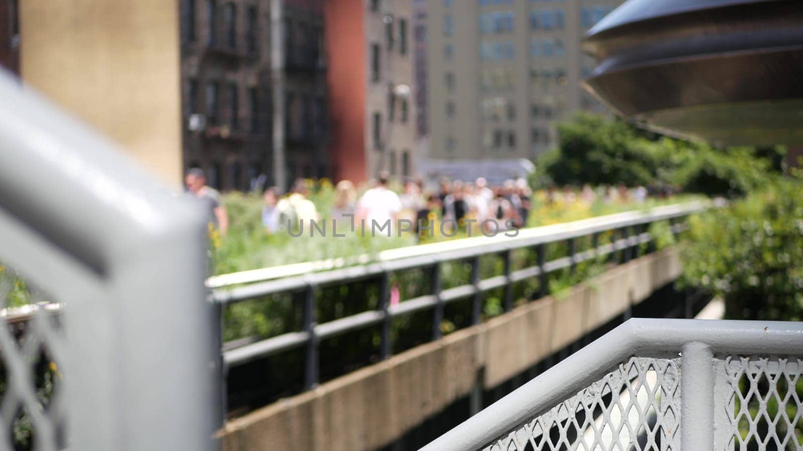 New York City, United States - 1 Sept 2023: High Line elevated greenway, Manhattan Midtown, USA. People walking in park. Promenade in garden greenery. American street life, Chelsea Hudson Yards.