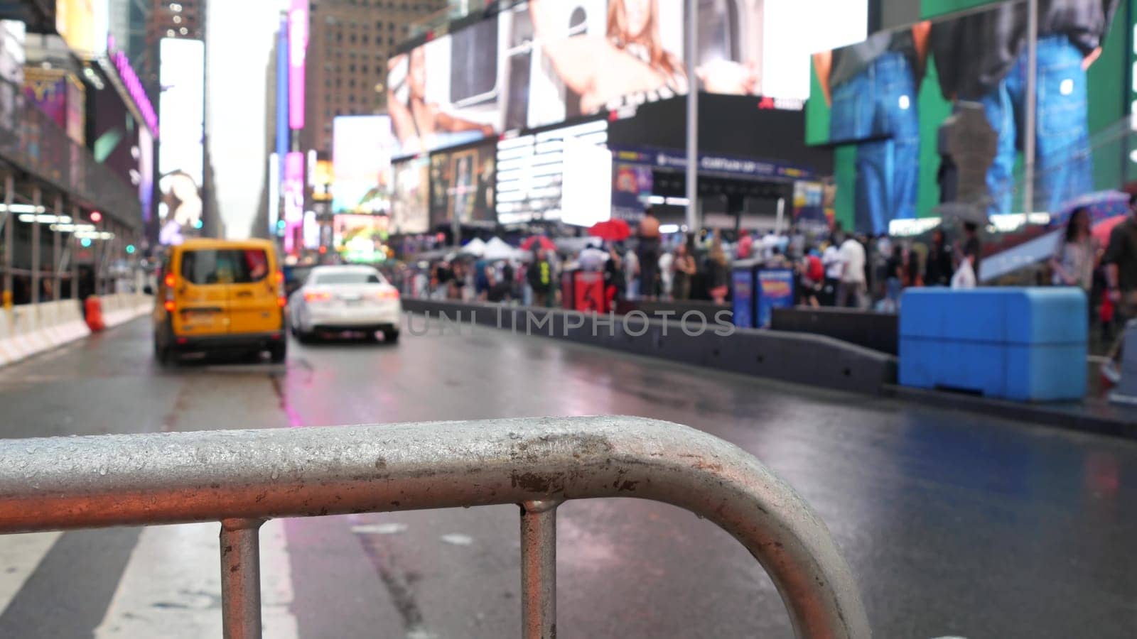 New York City, United States - 10 Sept 2023: Times Square, Manhattan Midtown Broadway street, USA. American yellow taxi cab, urban road traffic. People. Advertising signs, commercial billboard screens