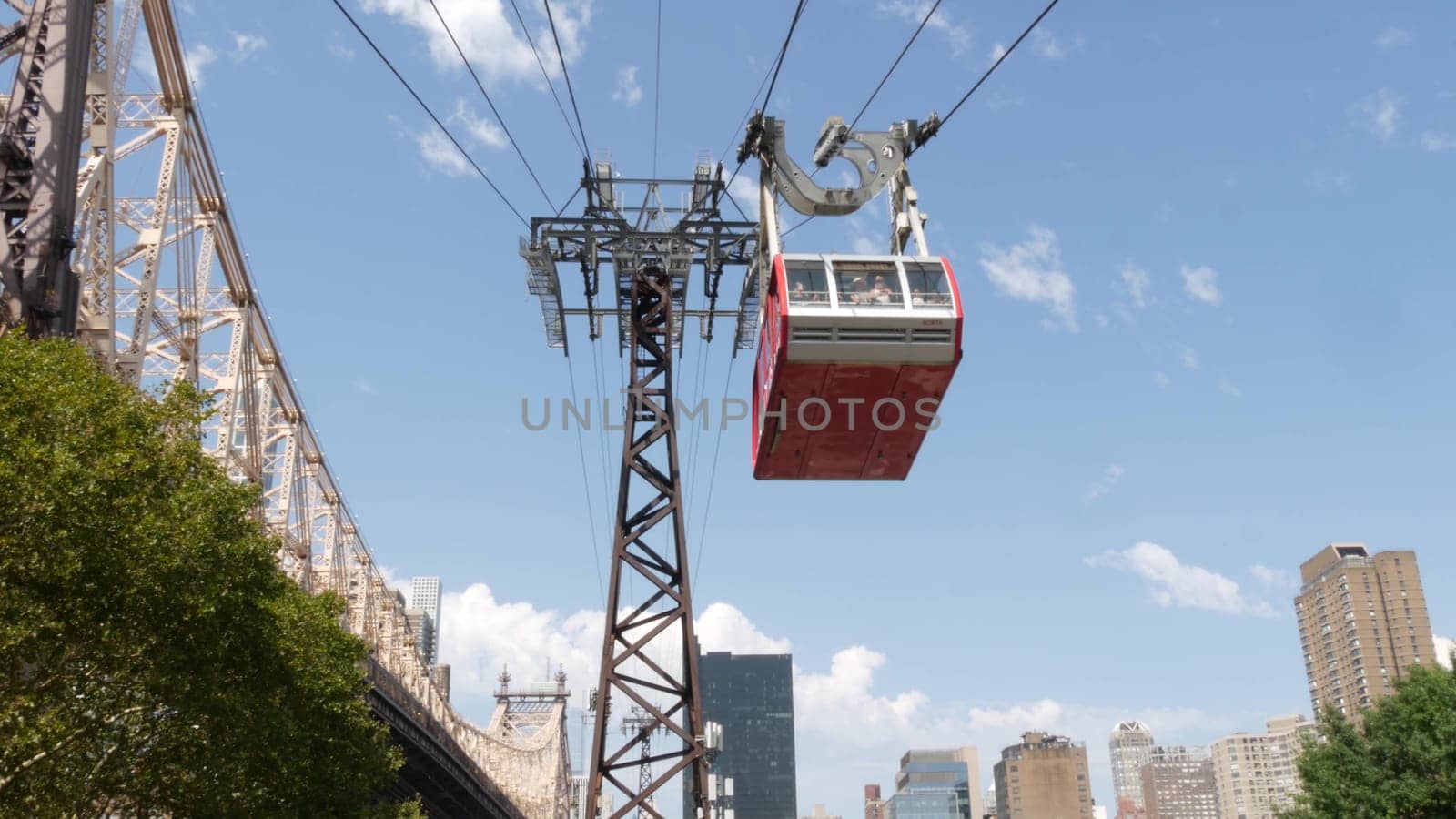 New York City, United States - 4 Sept 2023: Roosevelt Island tramway to Manhattan Midtown streets. American cable tram, Queensboro Bridge. Urban public transport, USA. Building architecture cityscape.