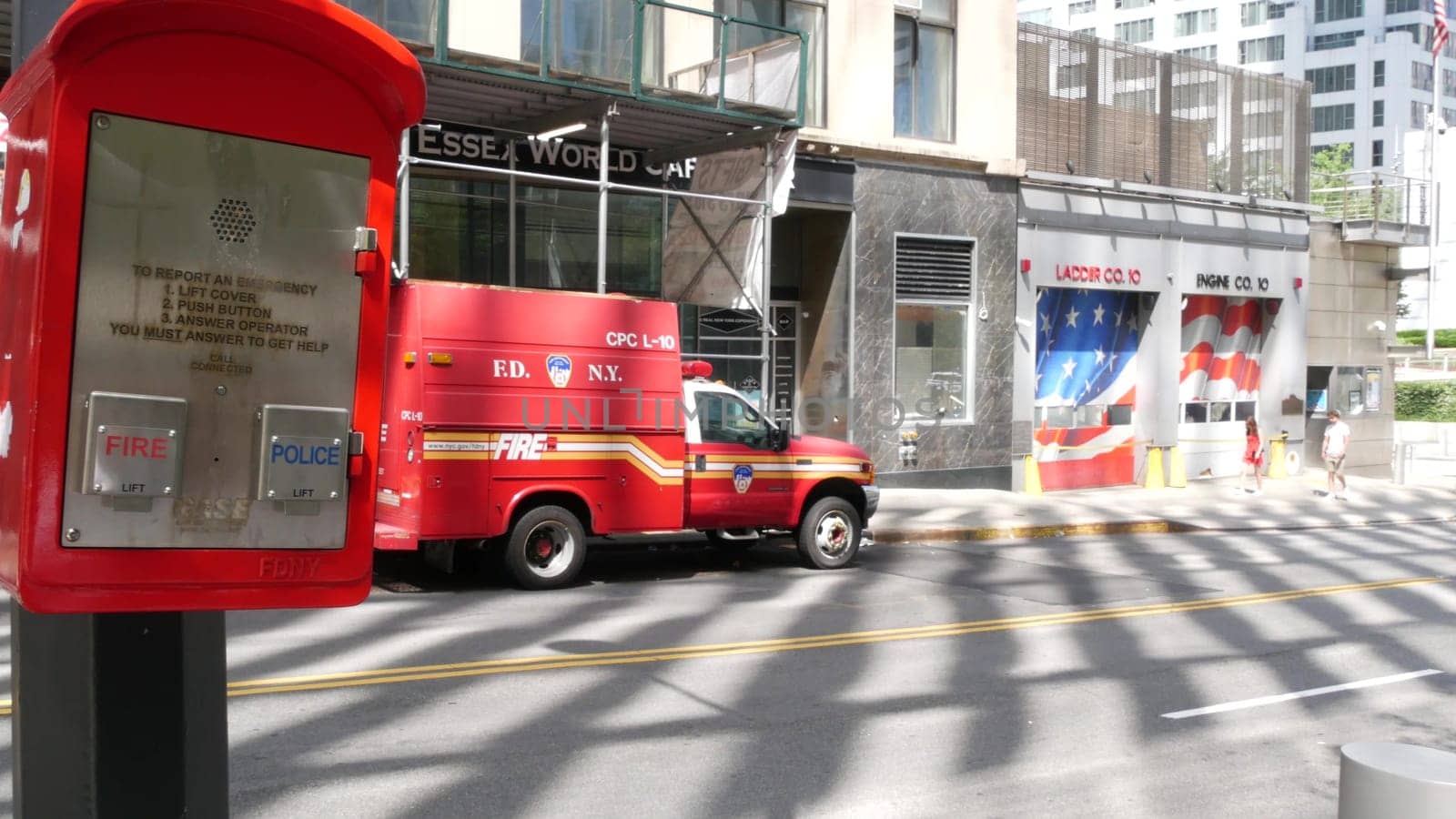 New York City, United States - 31 Aug 2023: NYFD car, USA fire department truck, american firefighters vehicle or fire fighter engine on NYC street near firemen station. FD 10 house or hall red gates.