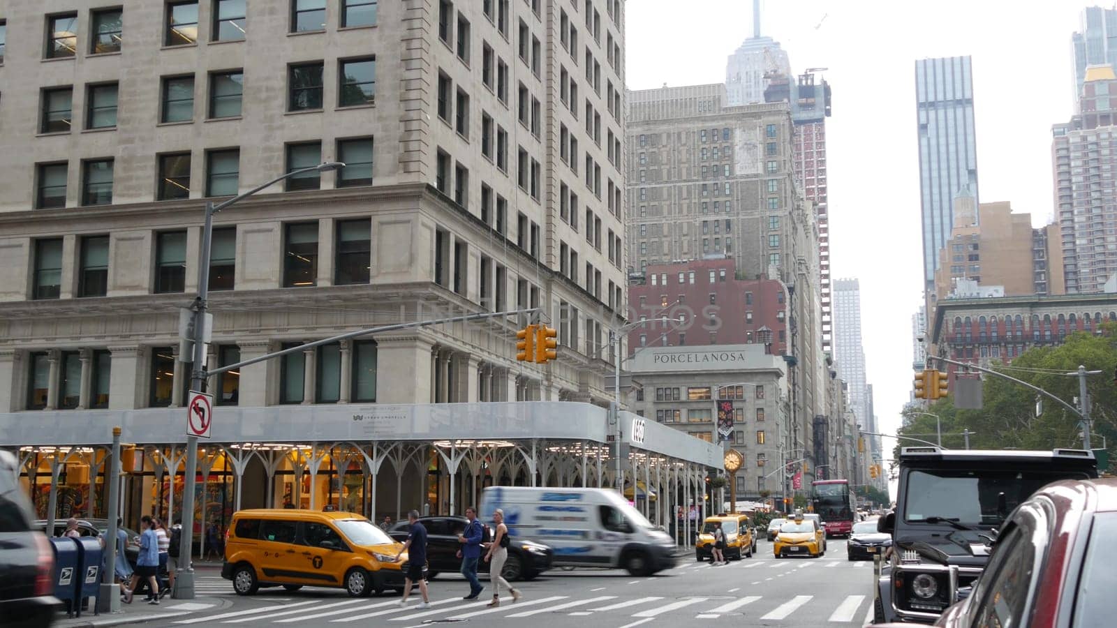 New York City, United States - 8 Sept 2023: Manhattan Midtown Broadway, 23 street, 5 avenue crossroad intersection. Worth Square near Madison Park and Flatiron Building, USA. People. Yellow taxi car