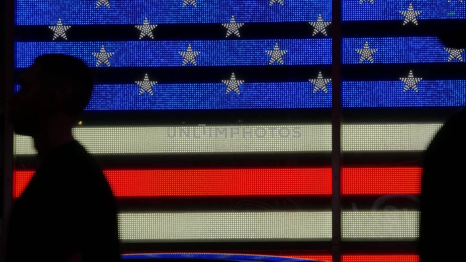 New York City, United States - 5 Sept 2023: Times Square, Manhattan Midtown Broadway street, USA. American flag, NYC urban life. Military island, army recruiting. People pedestrians silhouettes, crowd