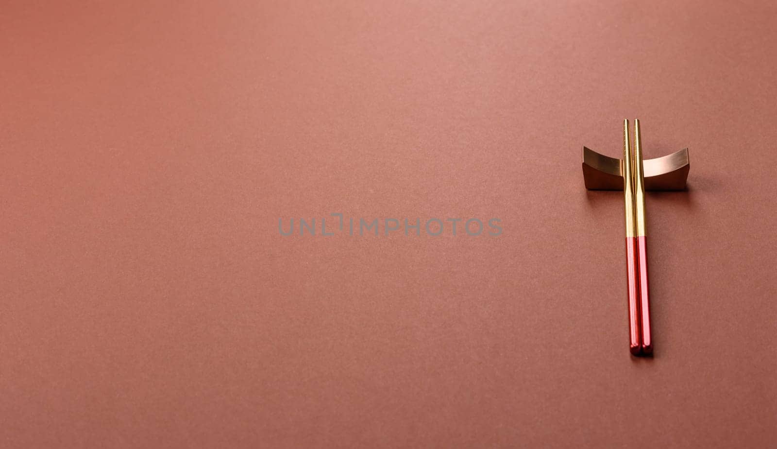 Chopsticks for sushi or other Japanese or Chinese food on a brownstone table. Asian chopsticks
