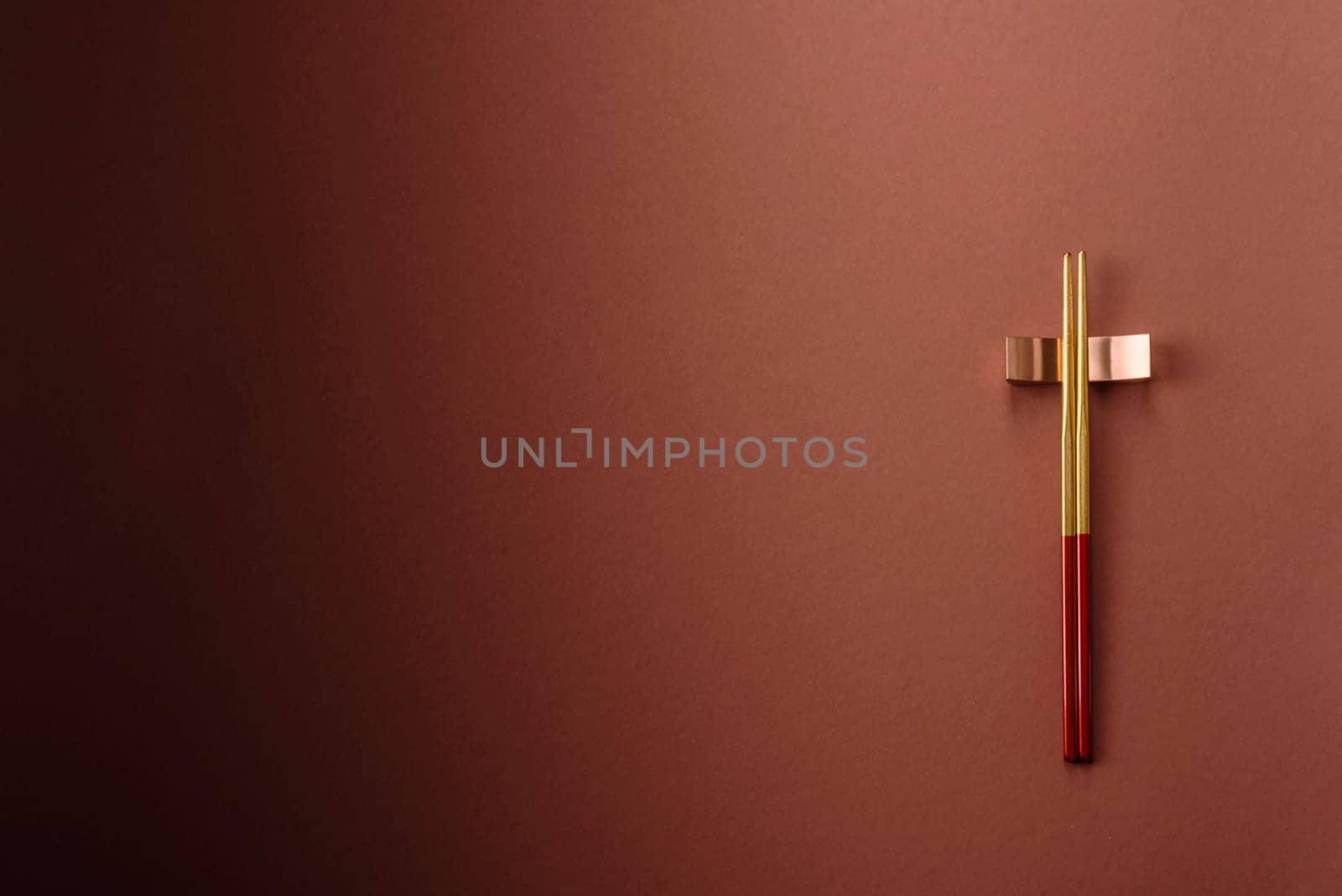 Chopsticks for sushi or other Japanese or Chinese food on a brownstone table. Asian chopsticks