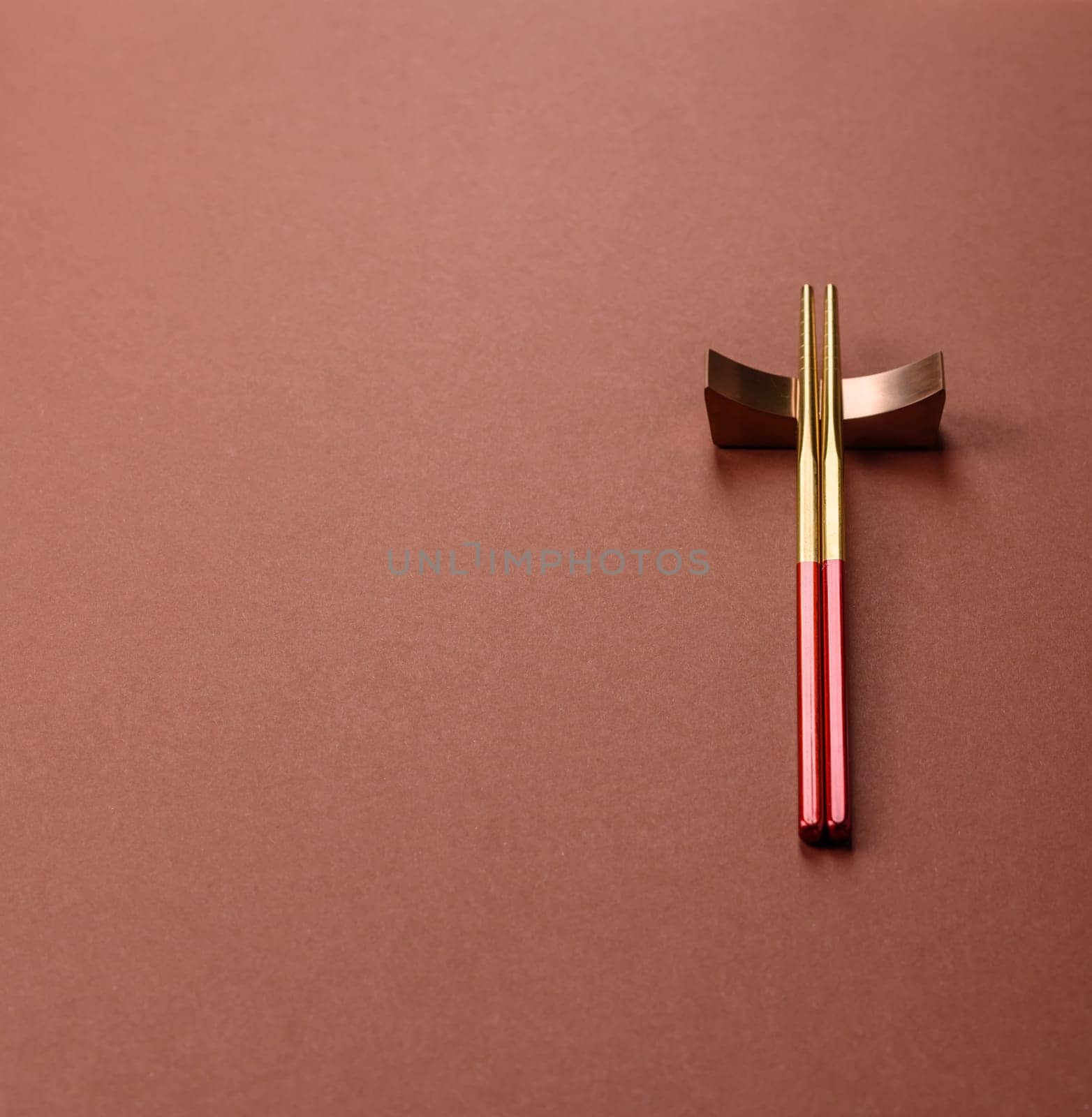 Chopsticks for sushi or other Japanese or Chinese food on a brownstone table. Asian chopsticks