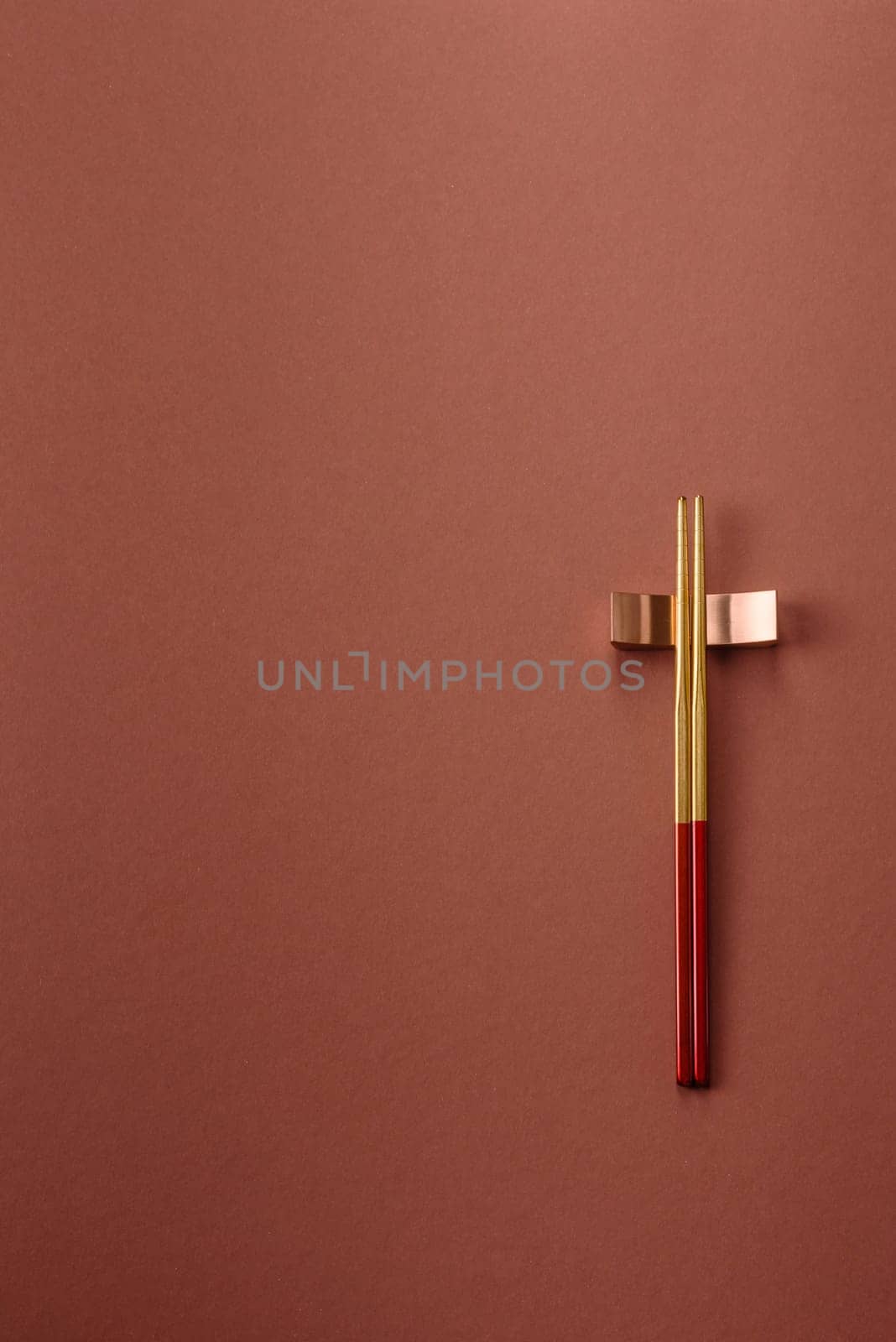 Chopsticks for sushi or other Japanese or Chinese food on a brownstone table. Asian chopsticks