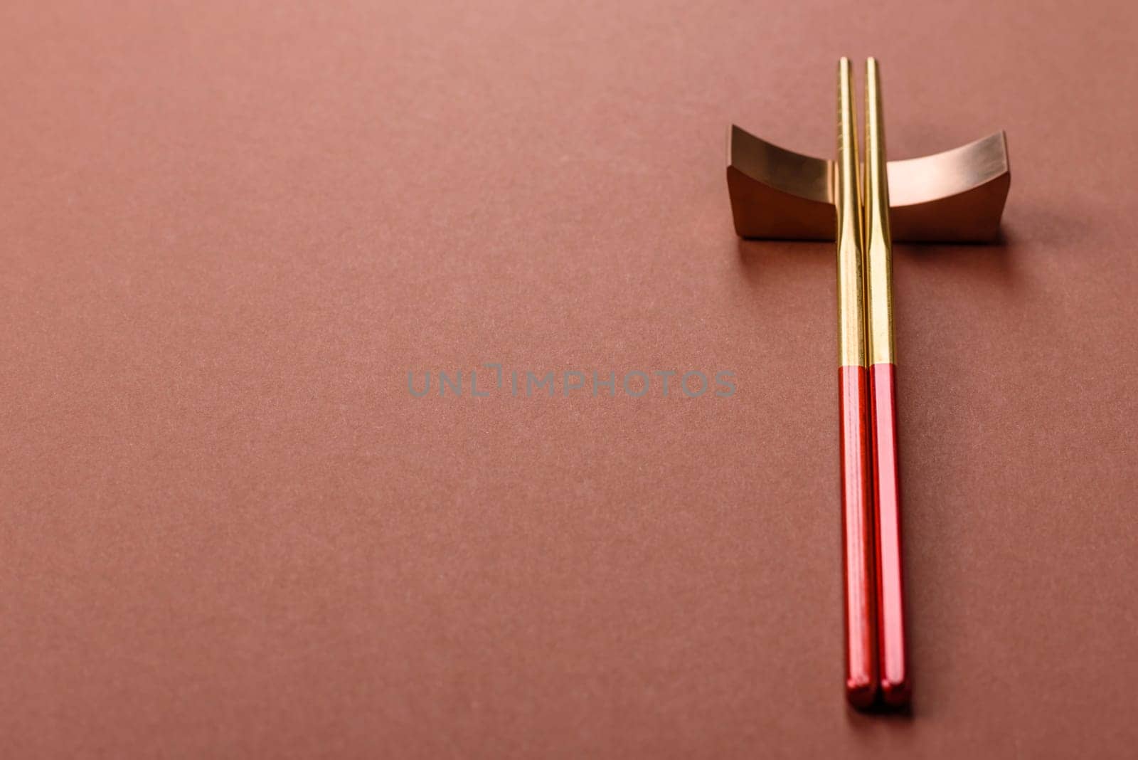 Chopsticks for sushi or other Japanese or Chinese food on a brownstone table. Asian chopsticks