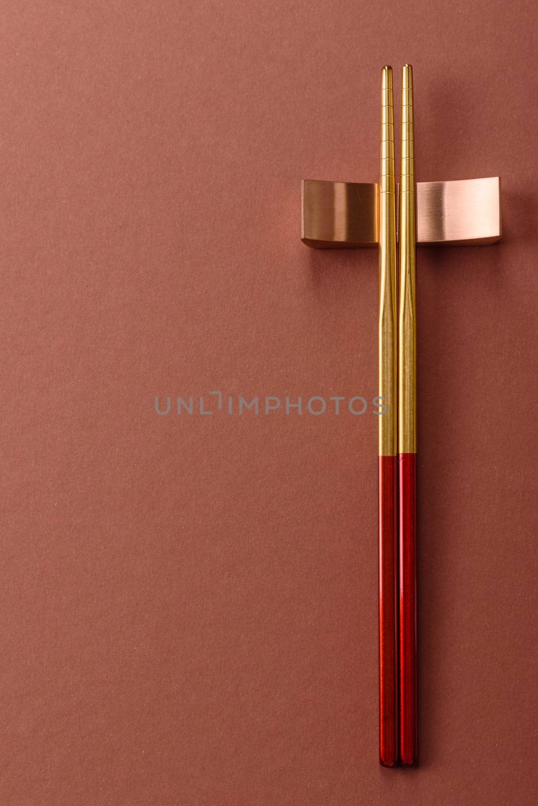 Chopsticks for sushi or other Japanese or Chinese food on a brownstone table. Asian chopsticks