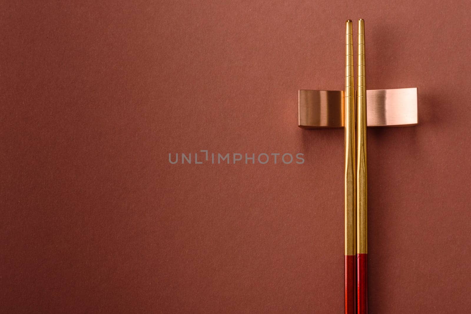 Chopsticks for sushi or other Japanese or Chinese food on a brownstone table. Asian chopsticks