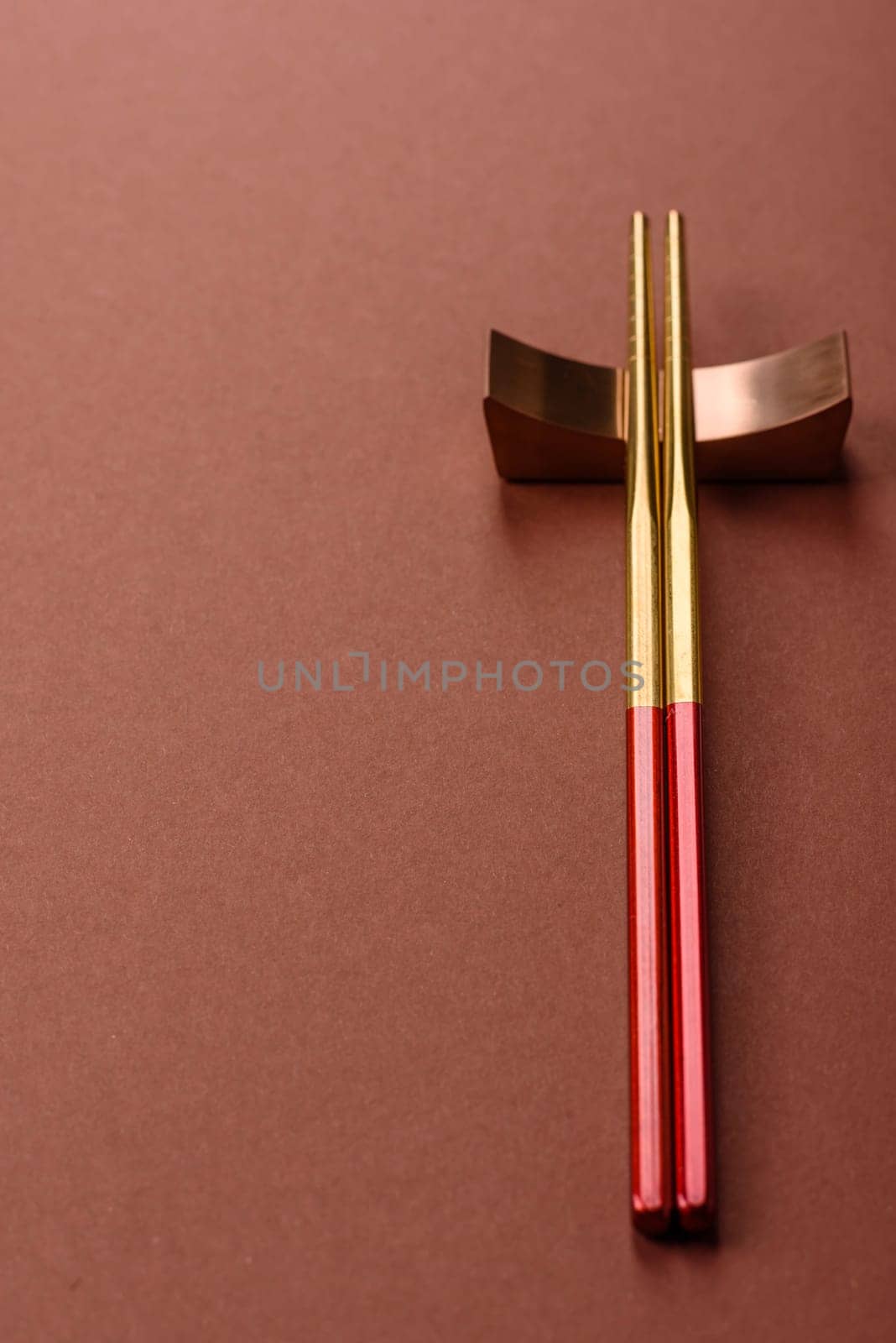 Chopsticks for sushi or other Japanese or Chinese food on a brownstone table. Asian chopsticks